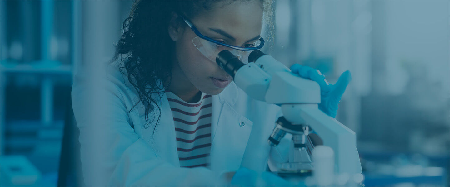 Scientist using a microscope